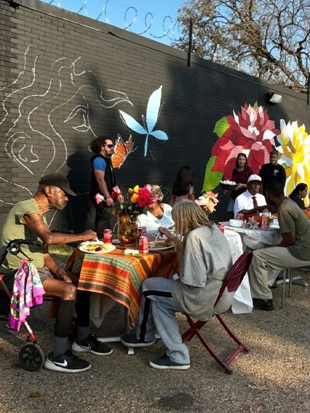 MaaPaa community members gathered for a Friendsgiving event, sharing a meal and time together.
