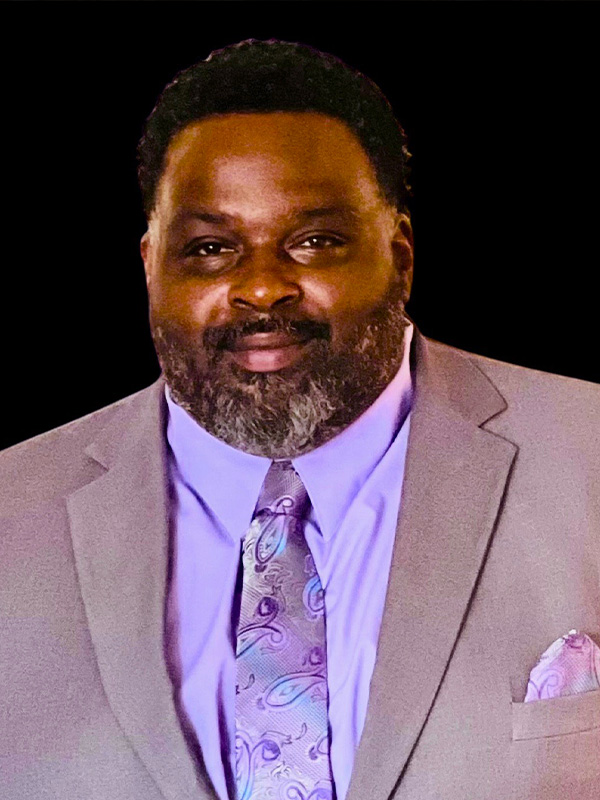 Head shot of male MaaPaa board member. His name is Vonshie Hutchins who is President at Unleashed Films.